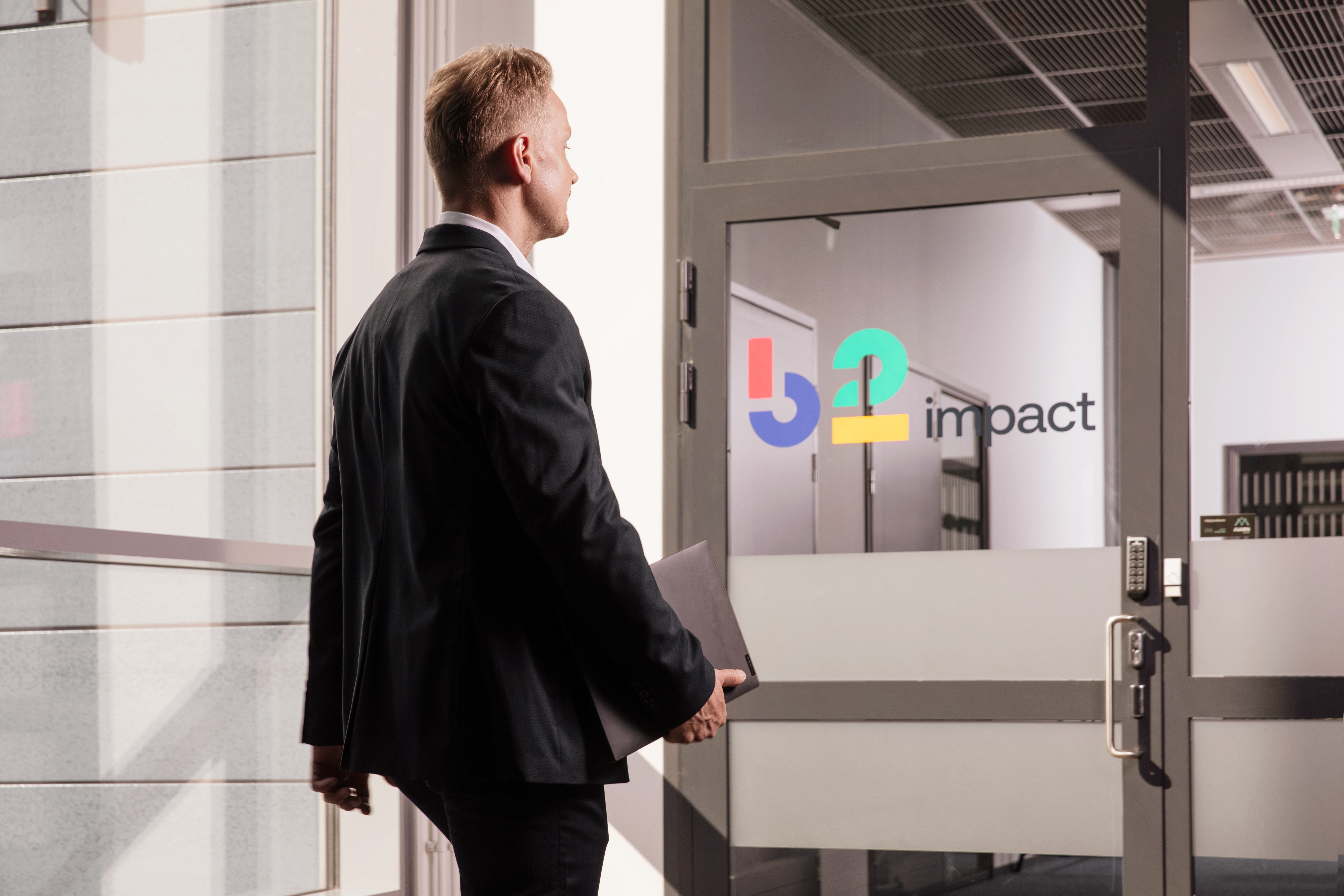 Man walking in an office corridor
